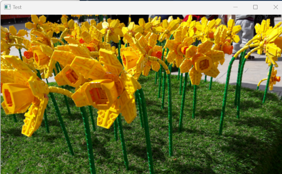 A user interface with a background picture of daffodils made out of lego.