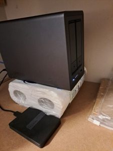 UGREEN server sitting on a kitchen roll pack